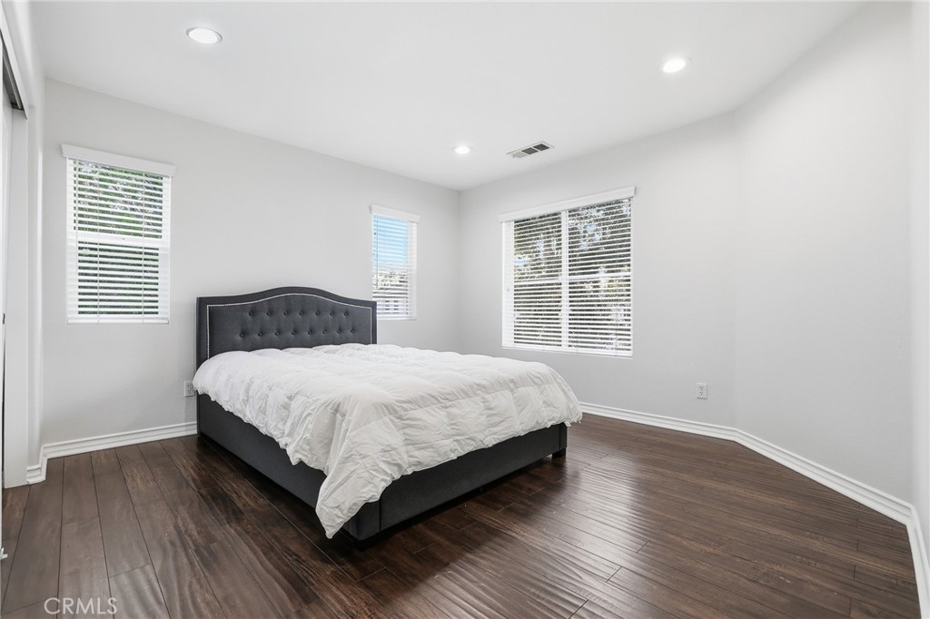 8220 Chamberlain Reseda, CA 91335 - Photo 33 of 46 a bedroom with a bed and windows