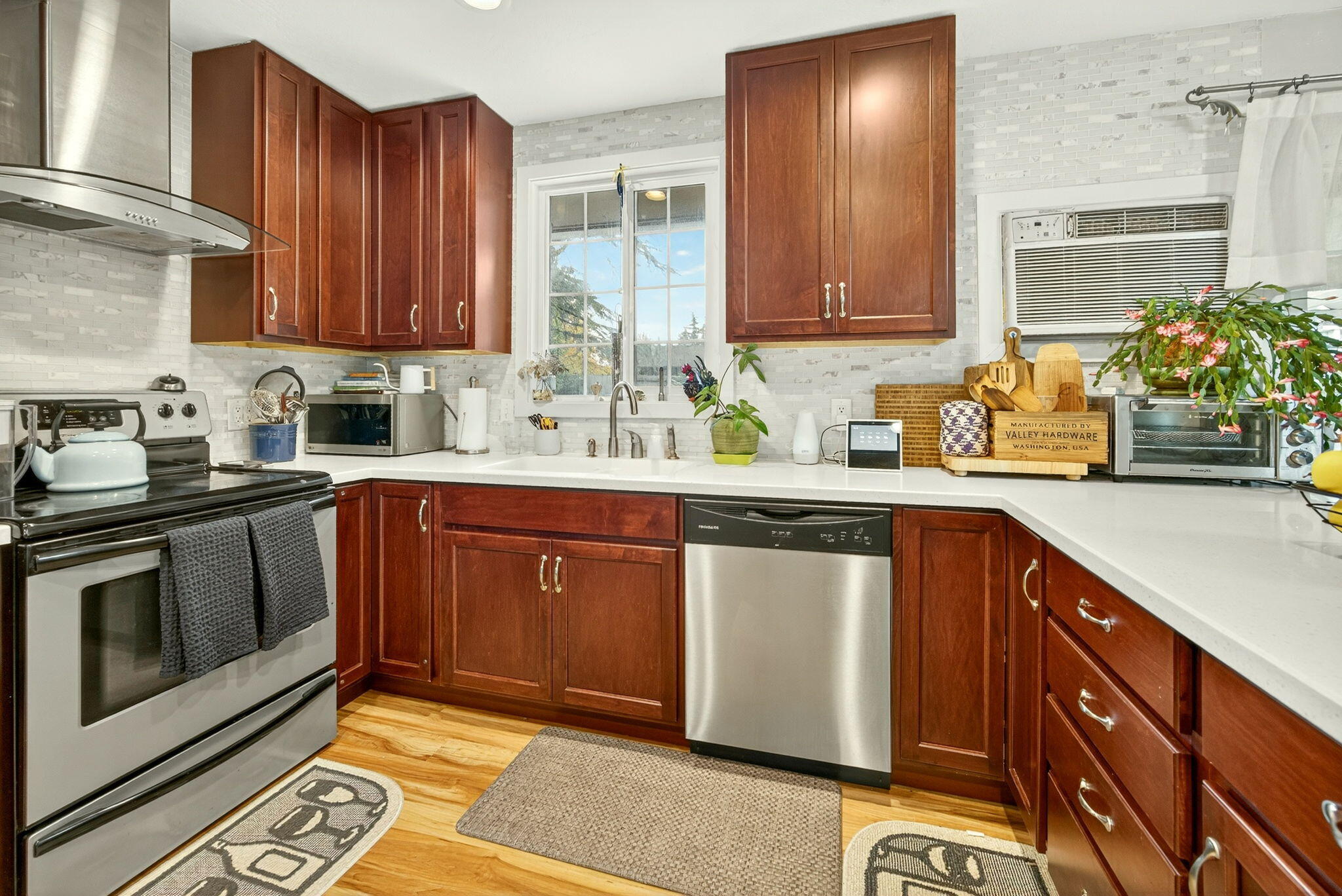 659 Herman Avenue Medford, OR 97501 - Photo 24 of 42 a kitchen with stainless steel appliances granite countertop a sink stove and cabinets