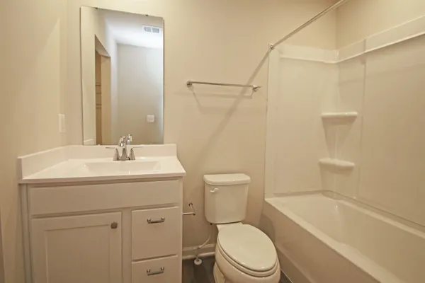 a bathroom with a sink a toilet and a bathtub