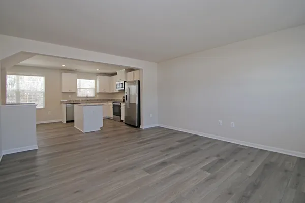 a view of kitchen with wooden floor