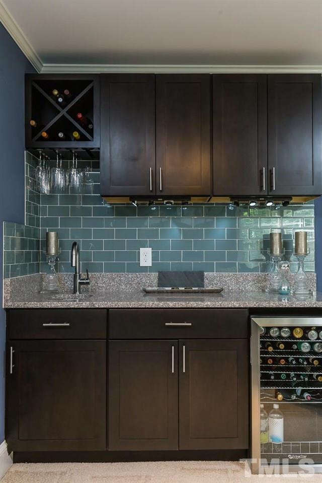 717 Bennington Drive Raleigh, NC 27615 - Photo 14 of 25 a kitchen with a sink a microwave a stove and a cabinets