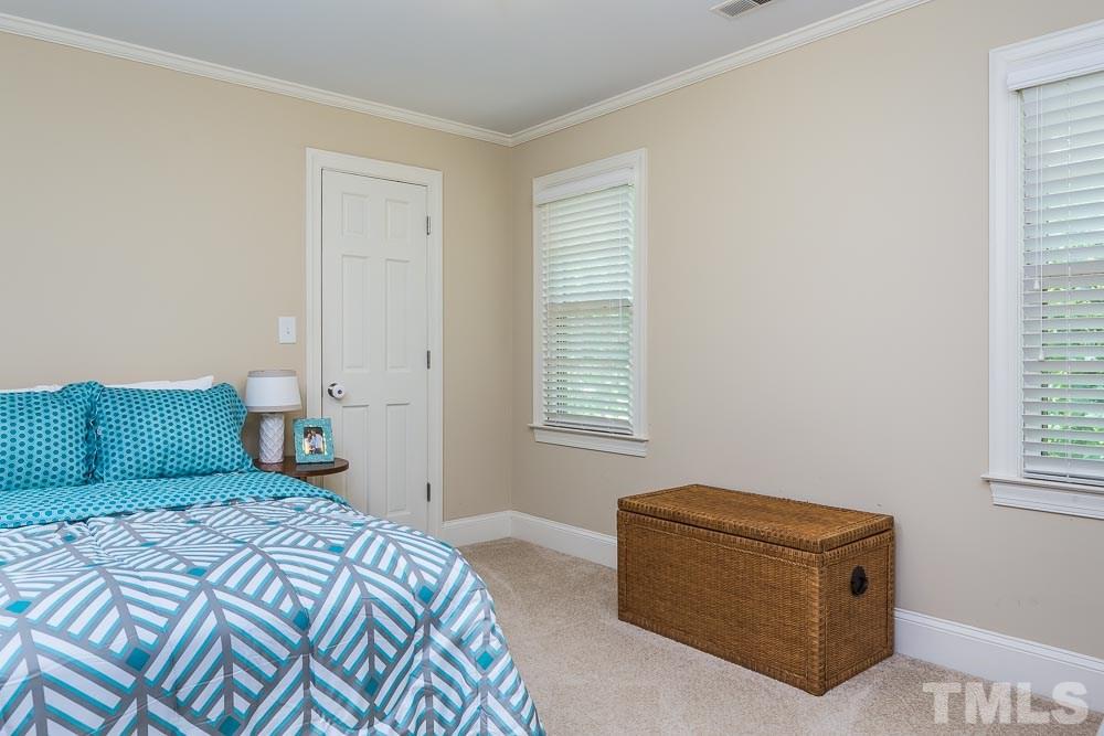 717 Bennington Drive Raleigh, NC 27615 - Photo 18 of 25 a bedroom with a bed and window