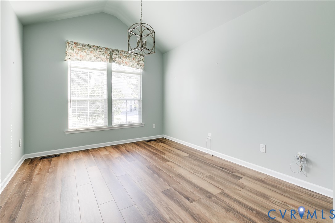 7538 South Franklins Way Quinton, VA 23141 - Photo 30 of 48 a view of an empty room with wooden floor and a window