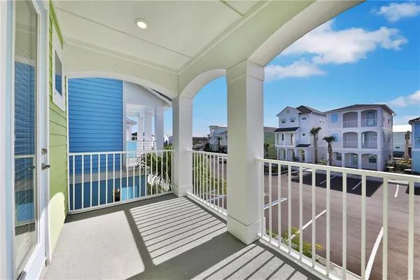 a view of bedroom and bedroom with wooden floor