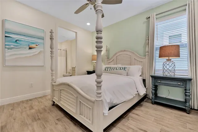 a view of residential houses with swimming pool and lake view