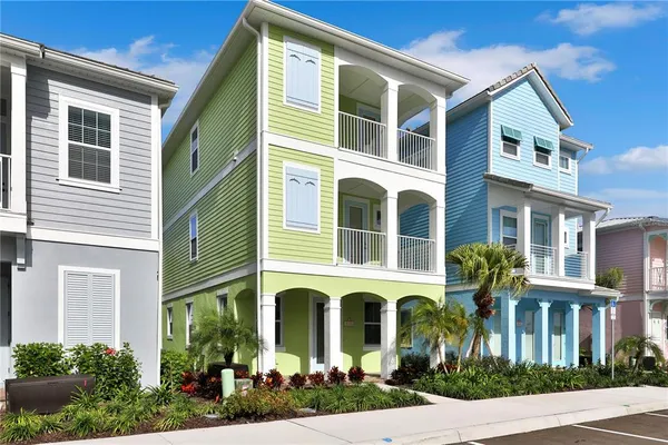 a view of a patio with couches table and chairs and potted plants