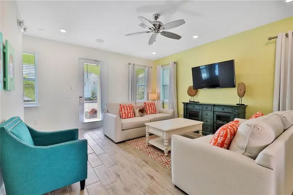 a living room with fireplace furniture and a flat screen tv
