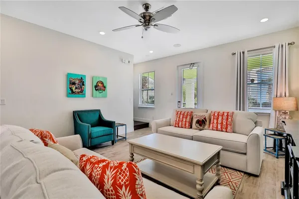 a living room with furniture and a large window