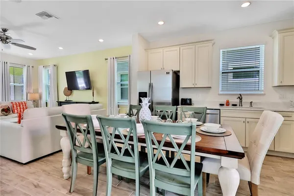 a view of a dining room with furniture and wooden floor