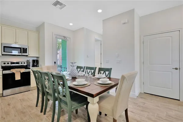a kitchen with a table and chairs in it