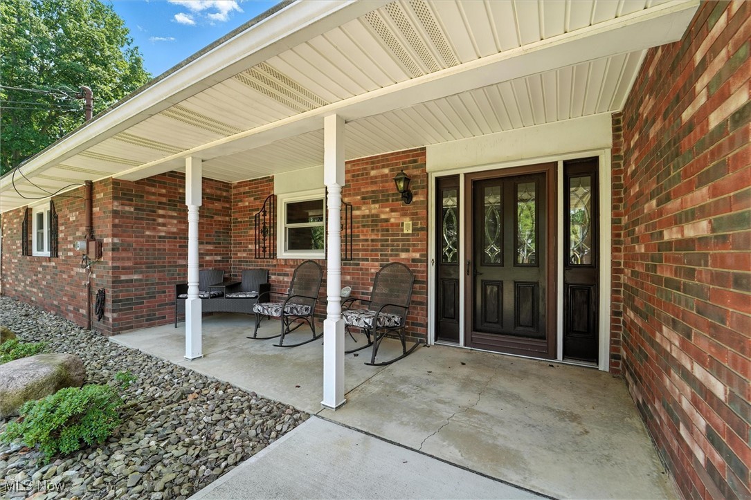 2930 South Ridge Road East Kingsville, OH 44048 - Photo 3 of 49 Entrance to property featuring a porch and brick siding