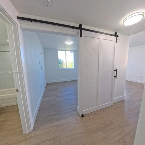 a view of entryway with wooden floor