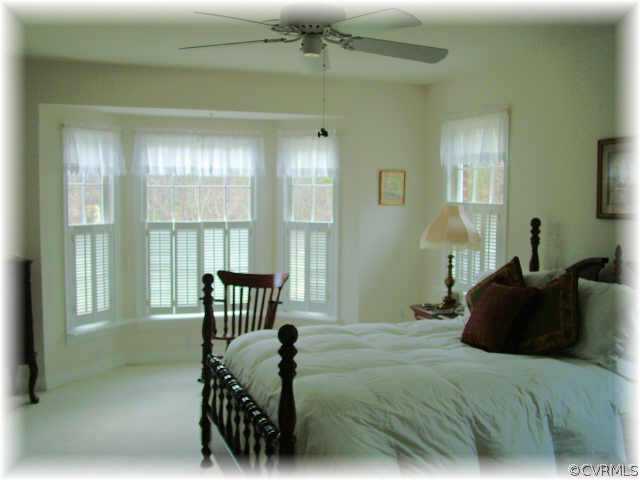 13570 Spring Run Road Midlothian, VA 23112 - Photo 6 of 10 a bedroom with a bed next to a window