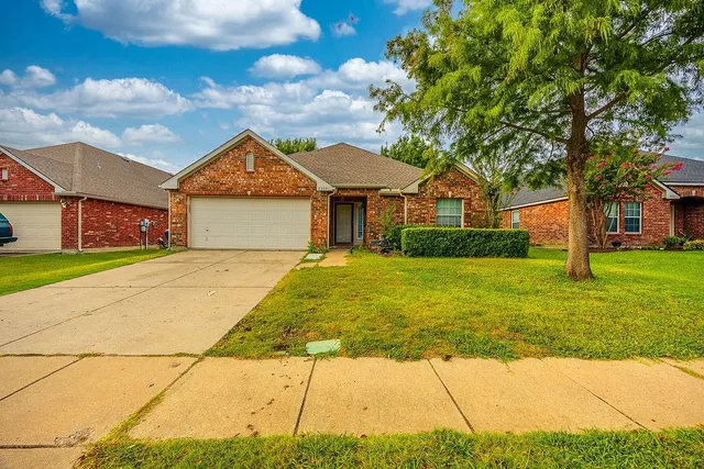 a front view of house with yard