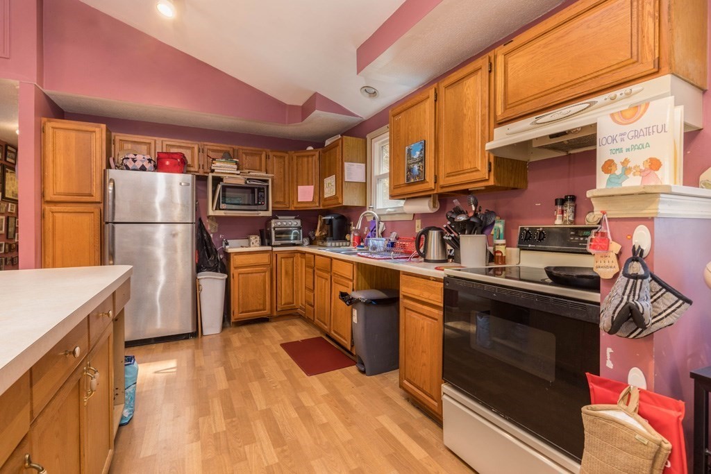21 Young Road Ashburnham, MA 01430 - Photo 3 of 16 a kitchen with refrigerator and cabinets