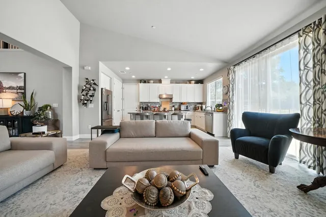 a living room with furniture fireplace and flat screen tv