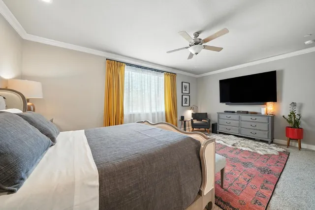 a bathroom with a double vanity sink a mirror a bathtub and shower