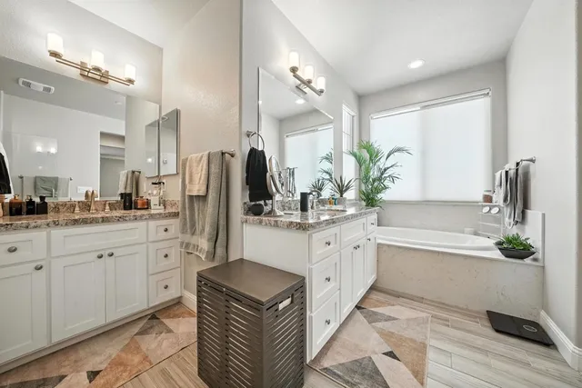 a white bath tub sitting in a bathroom
