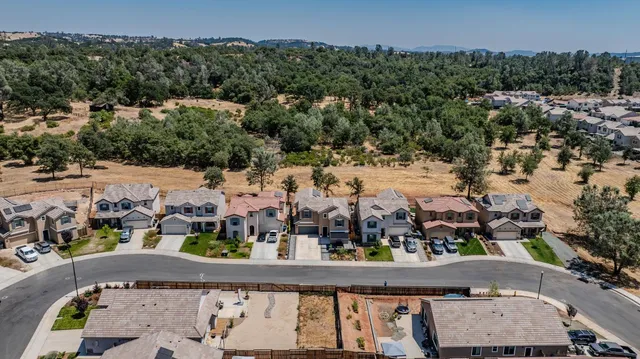 a roof deck with table and chairs