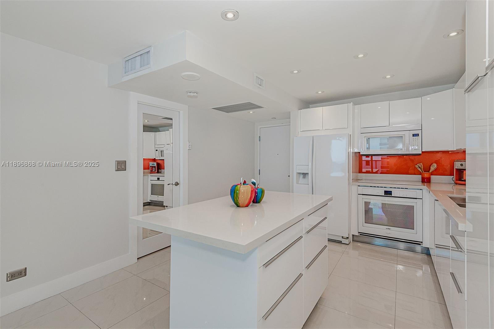 2301 Collins Avenue, Unit 1211 Miami Beach, FL 33139 - Photo 12 of 24 a storage room with cabinets and appliances