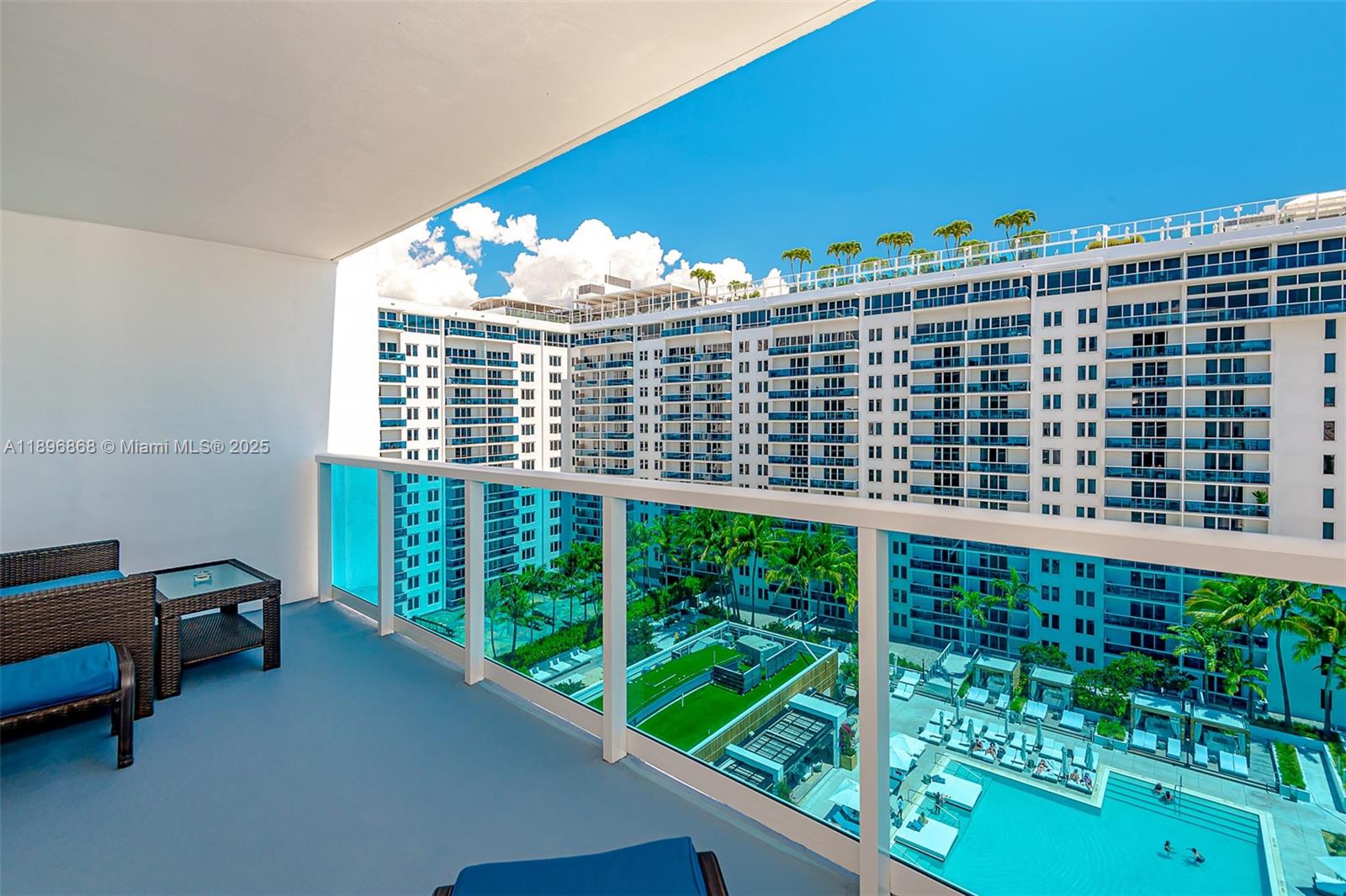 2301 Collins Avenue, Unit 1211 Miami Beach, FL 33139 - Photo 23 of 24 a view of a balcony with chairs
