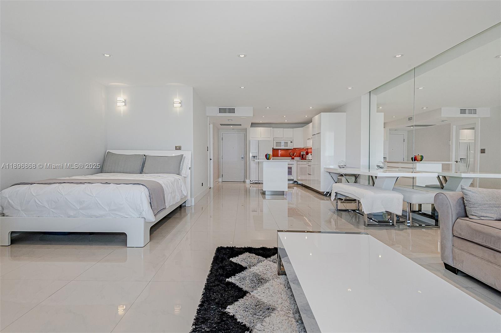 2301 Collins Avenue, Unit 1211 Miami Beach, FL 33139 - Photo 7 of 24 a living room with furniture and a couch