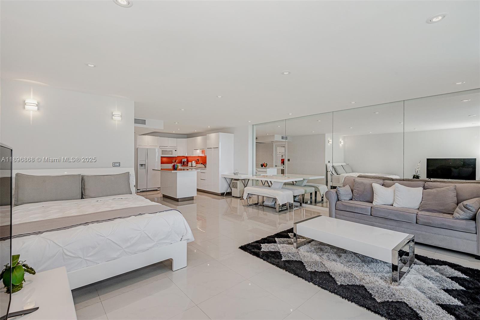 2301 Collins Avenue, Unit 1211 Miami Beach, FL 33139 - Photo 8 of 24 a bedroom with furniture and a couch