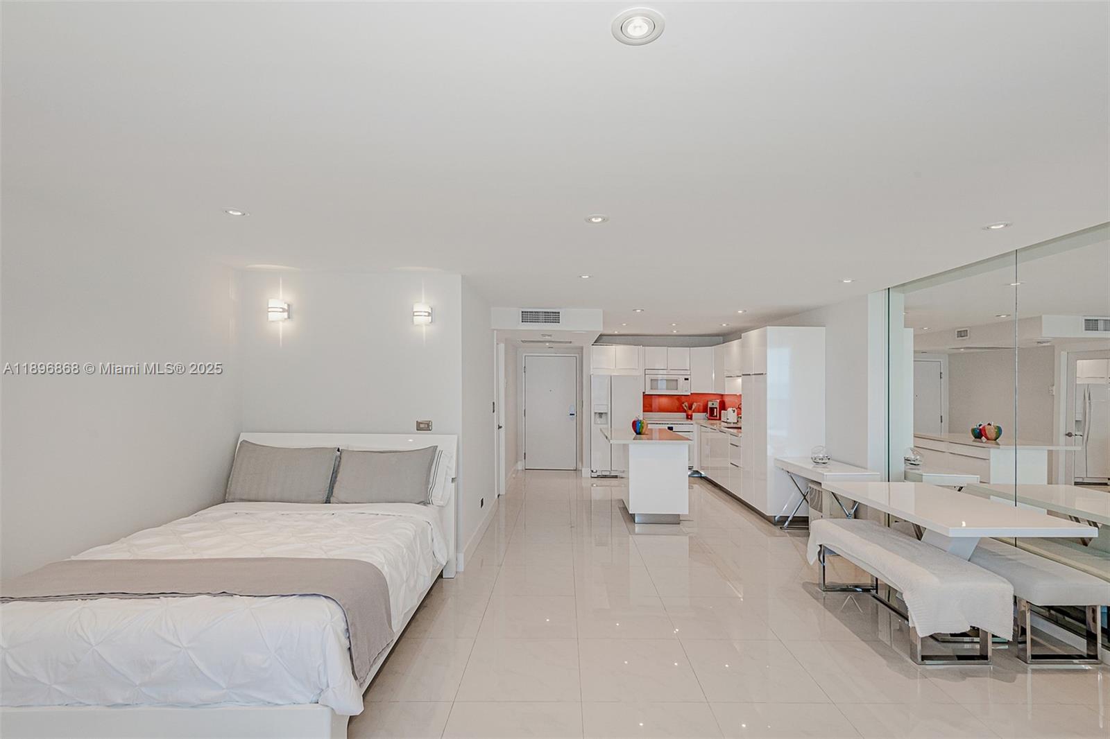 2301 Collins Avenue, Unit 1211 Miami Beach, FL 33139 - Photo 9 of 24 a bedroom with a bed and furniture