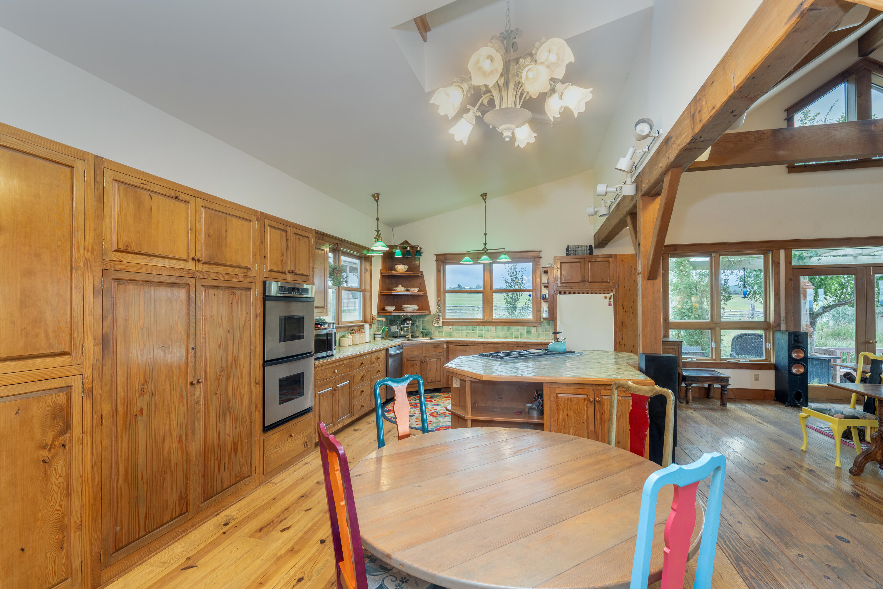 1226 County Rd X45 Norwood, CO 81423 - Photo 11 of 32 a large kitchen with stainless steel appliances granite countertop a stove and refrigerator