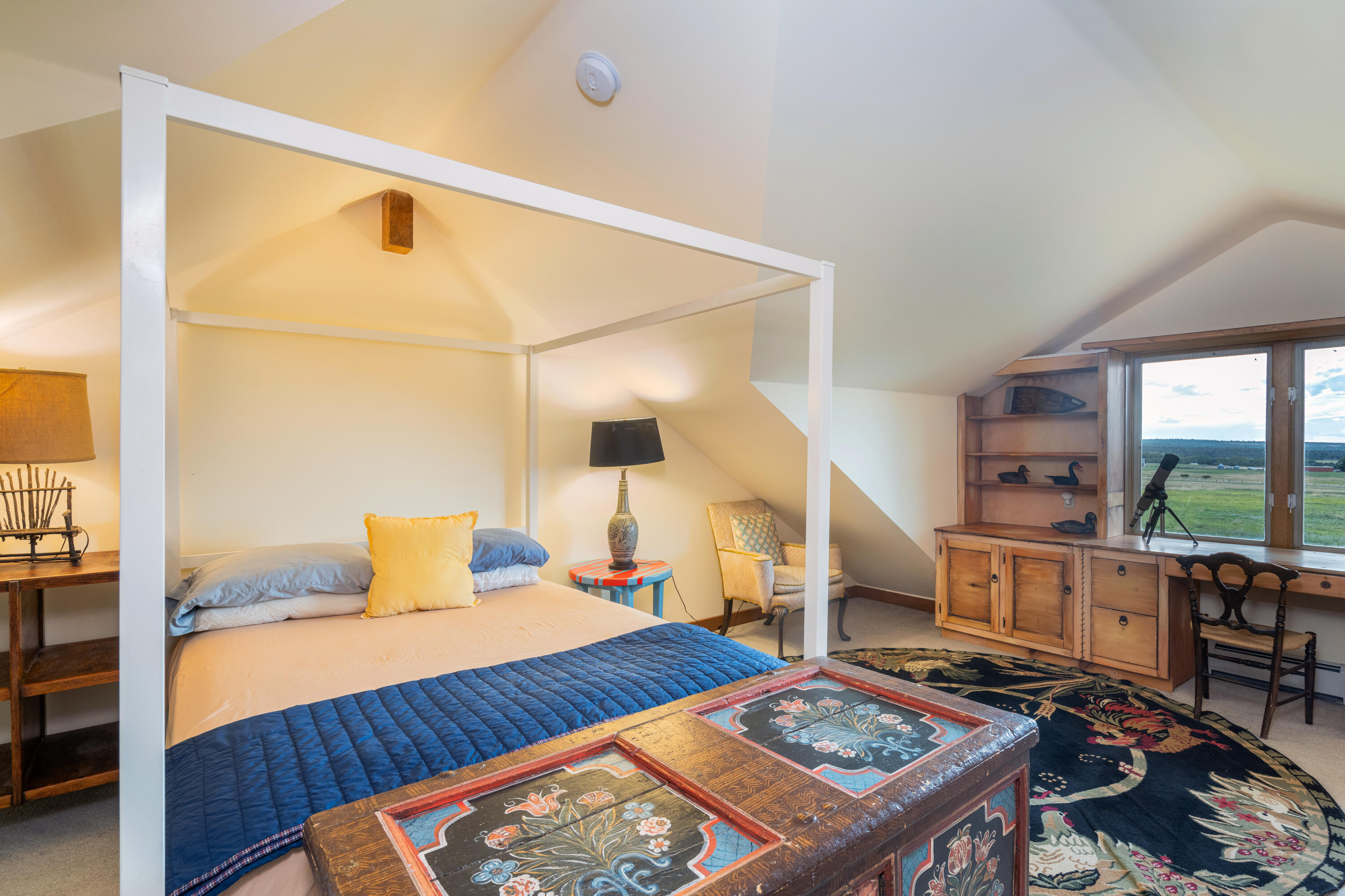 1226 County Rd X45 Norwood, CO 81423 - Photo 14 of 32 a bedroom with a bed and a table in it