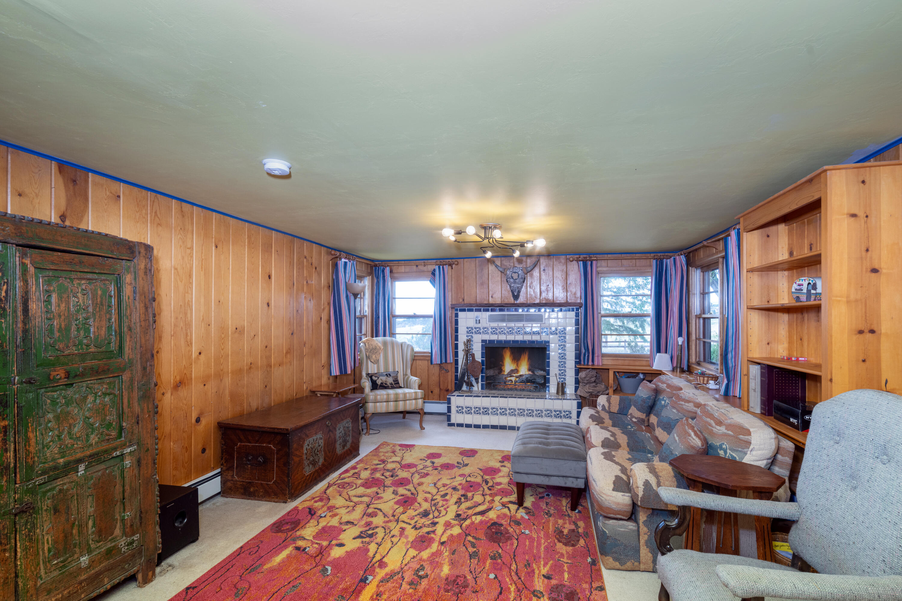 1226 County Rd X45 Norwood, CO 81423 - Photo 16 of 32 a living room with furniture and a fireplace