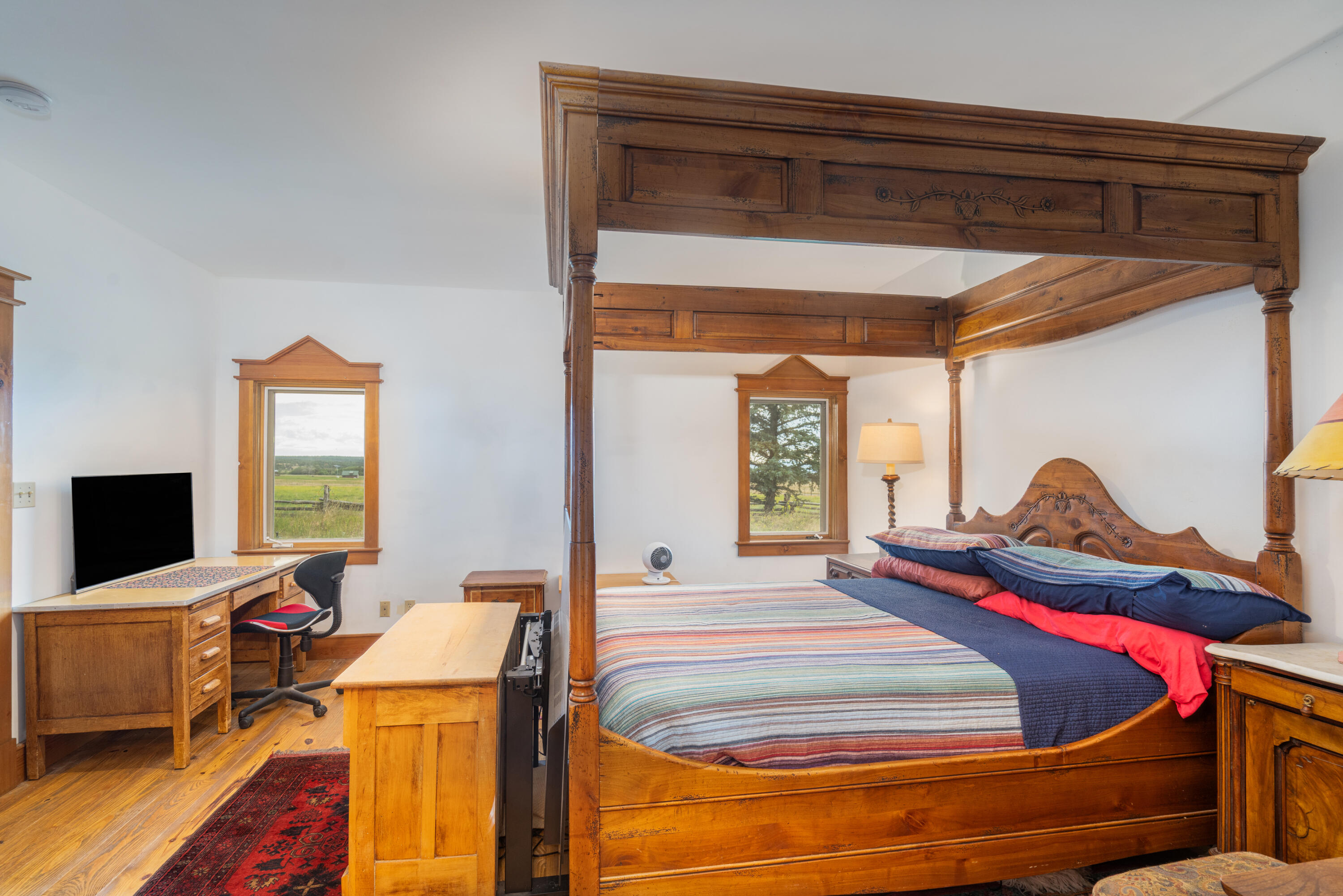 1226 County Rd X45 Norwood, CO 81423 - Photo 17 of 32 a room with a bed and a flat screen tv