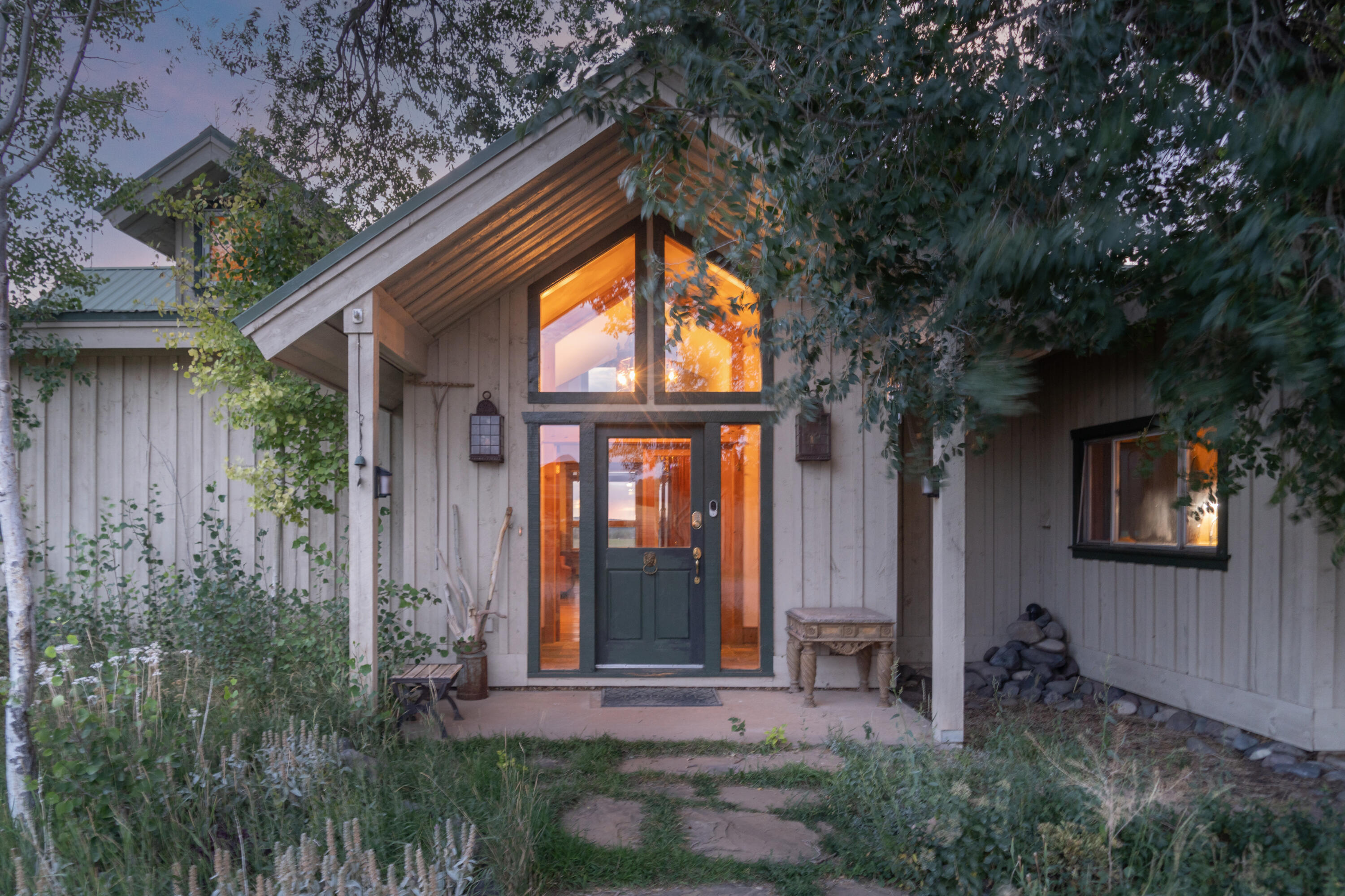 1226 County Rd X45 Norwood, CO 81423 - Photo 6 of 32 a front view of a house with garden