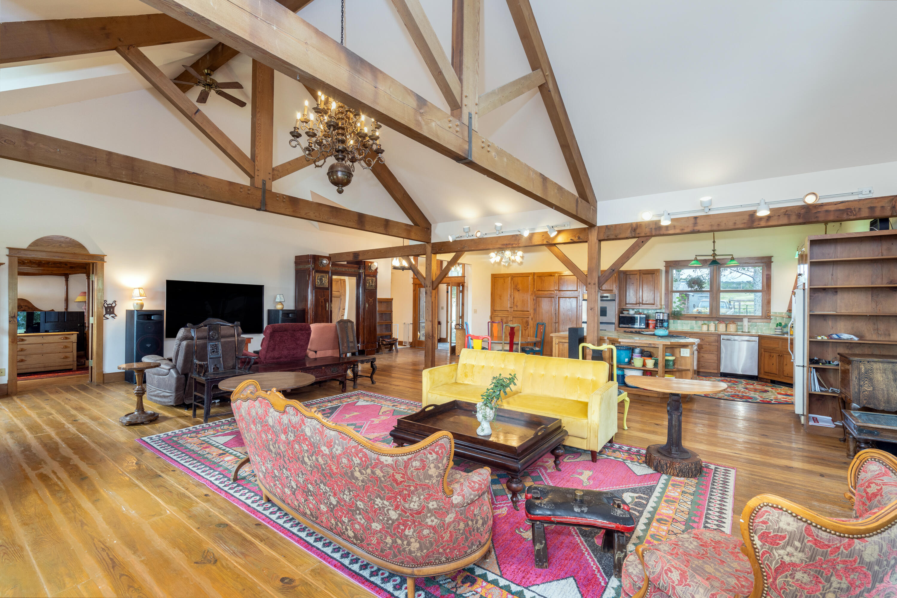 1226 County Rd X45 Norwood, CO 81423 - Photo 9 of 32 a living room with furniture a fireplace and a table