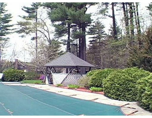 14 Governor Fuller Road Billerica, MA 01821 - Photo 5 of 12 a sign that is sitting in front of a house with large trees