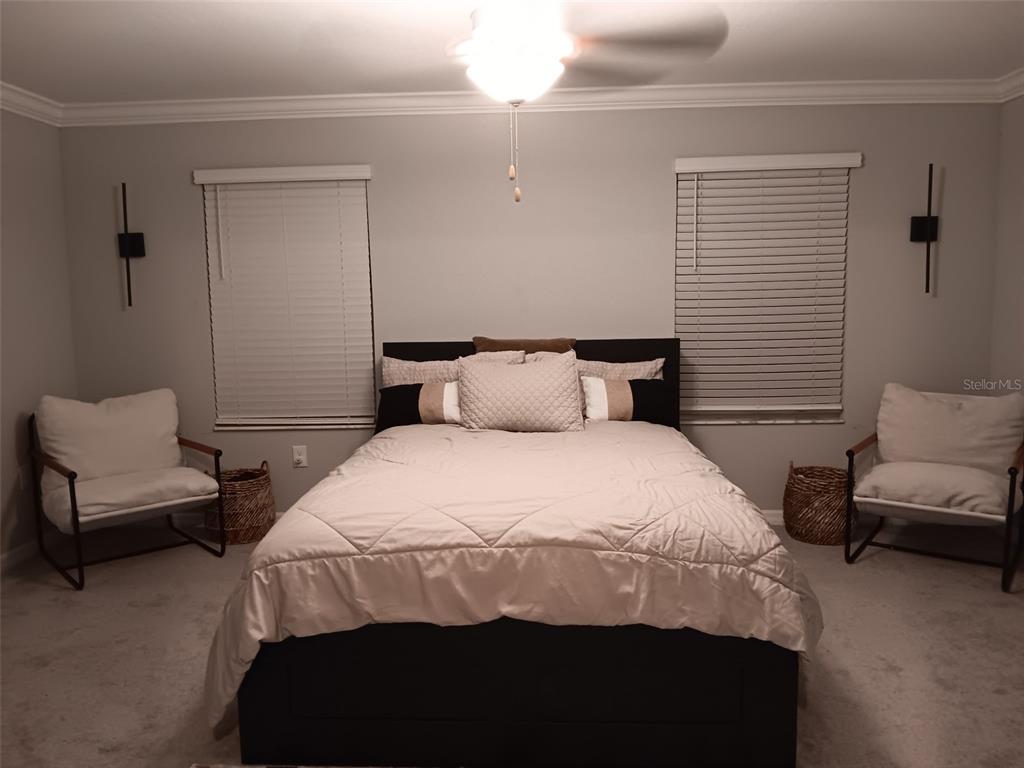 11768 Dumaine Valley Road Riverview, FL 33579 - Photo 4 of 6 a bedroom with a bed and a couch