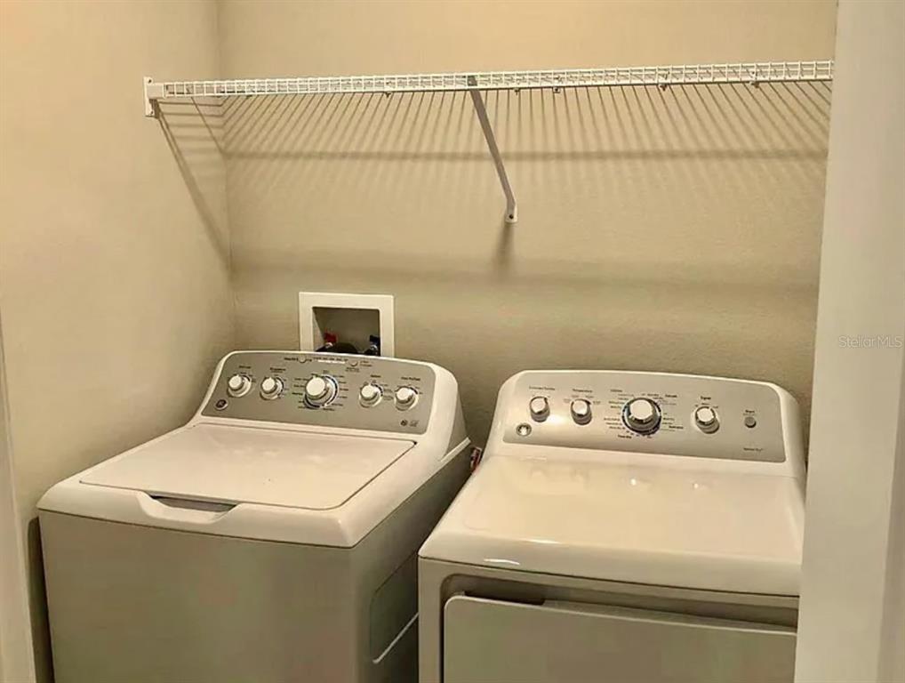 11768 Dumaine Valley Road Riverview, FL 33579 - Photo 5 of 6 a utility room with dryer and washer