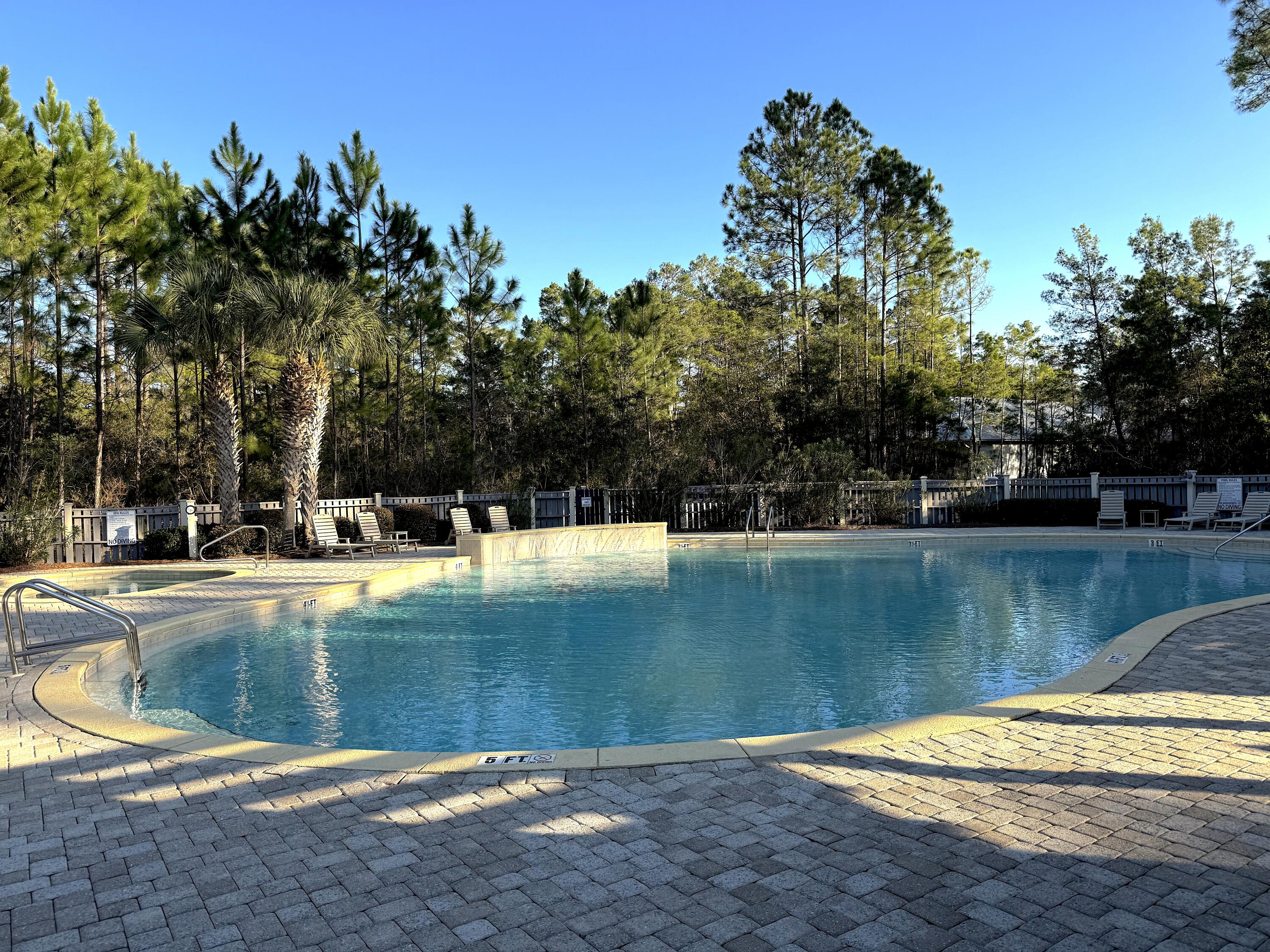 32 East Point Washington Road Santa Rosa Beach, FL 32459 - Photo 3 of 12 a view of a swimming pool with a yard