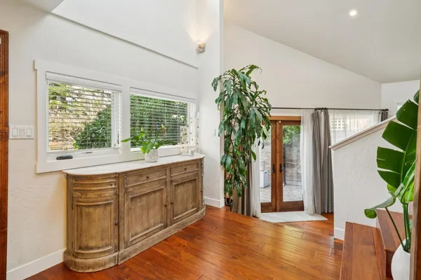 a view of a dining room with furniture window and wooden floor