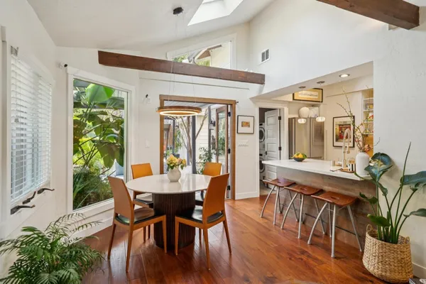 a kitchen with stainless steel appliances a stove a sink a refrigerator and cabinets