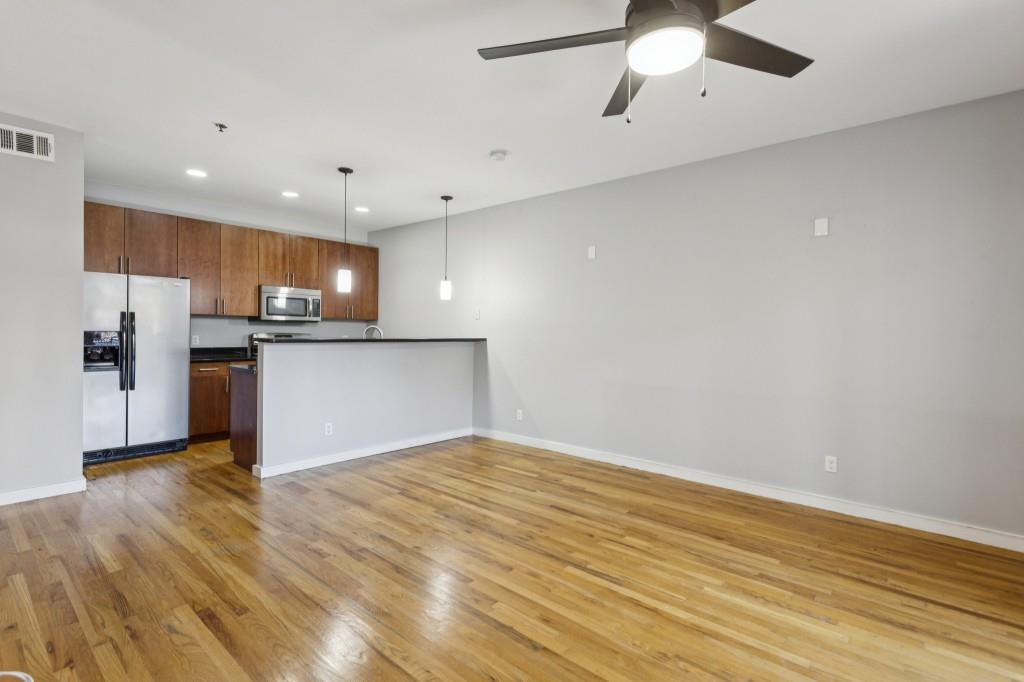 238 Walker Street Southwest, Unit 39 Atlanta, GA 30313 - Photo 12 of 35 a view of kitchen with refrigerator and microwave