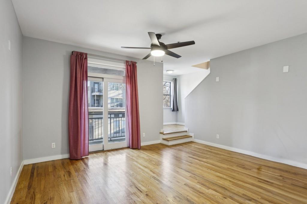 238 Walker Street Southwest, Unit 39 Atlanta, GA 30313 - Photo 16 of 35 wooden floor in an empty room with a window