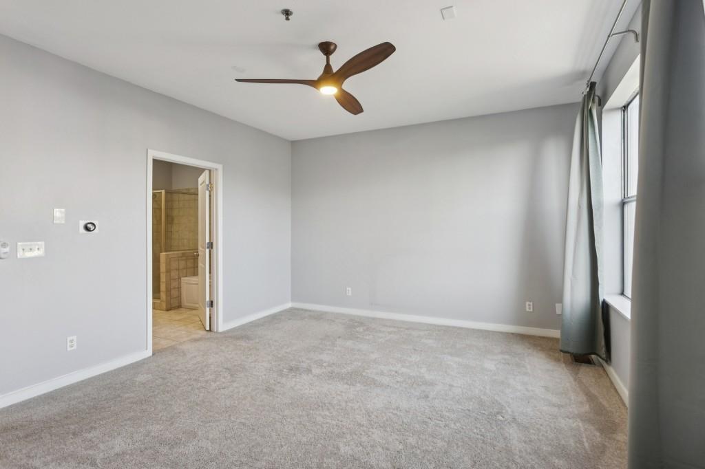 238 Walker Street Southwest, Unit 39 Atlanta, GA 30313 - Photo 20 of 35 an empty room with closet and windows