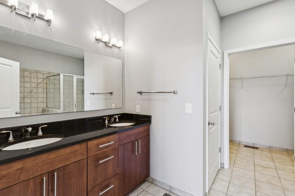 238 Walker Street Southwest, Unit 39 Atlanta, GA 30313 - Photo 22 of 35 a bathroom with a sink and a mirror