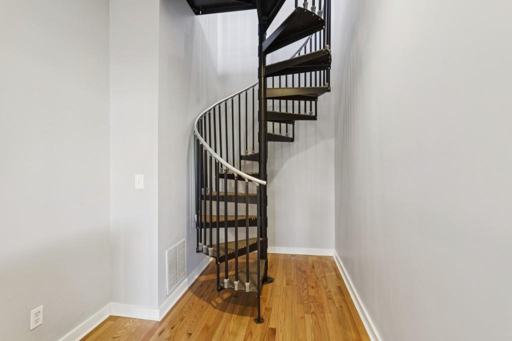 238 Walker Street Southwest, Unit 39 Atlanta, GA 30313 - Photo 24 of 35 an entryway with wooden floor and stairs