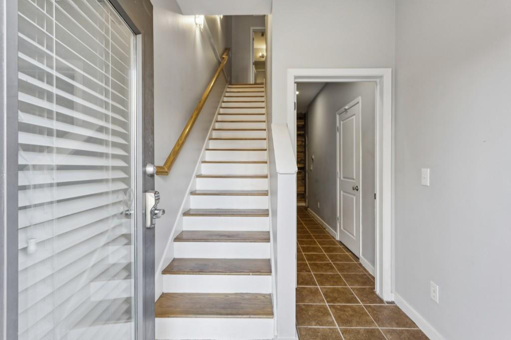 238 Walker Street Southwest, Unit 39 Atlanta, GA 30313 - Photo 8 of 35 a view of staircase with white walls and windows