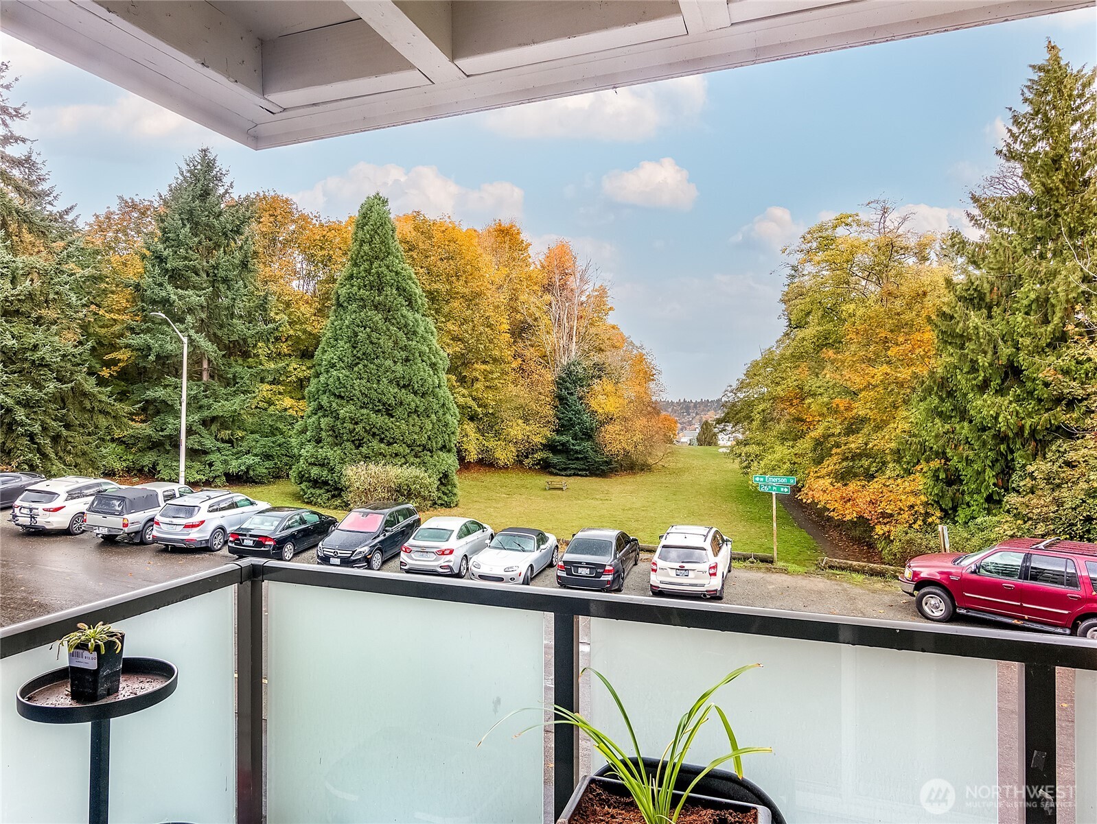 3722 27th Place West, Unit 101 Seattle, WA 98199 - Photo 16 of 17 a view of swimming pool with outdoor seating and plants