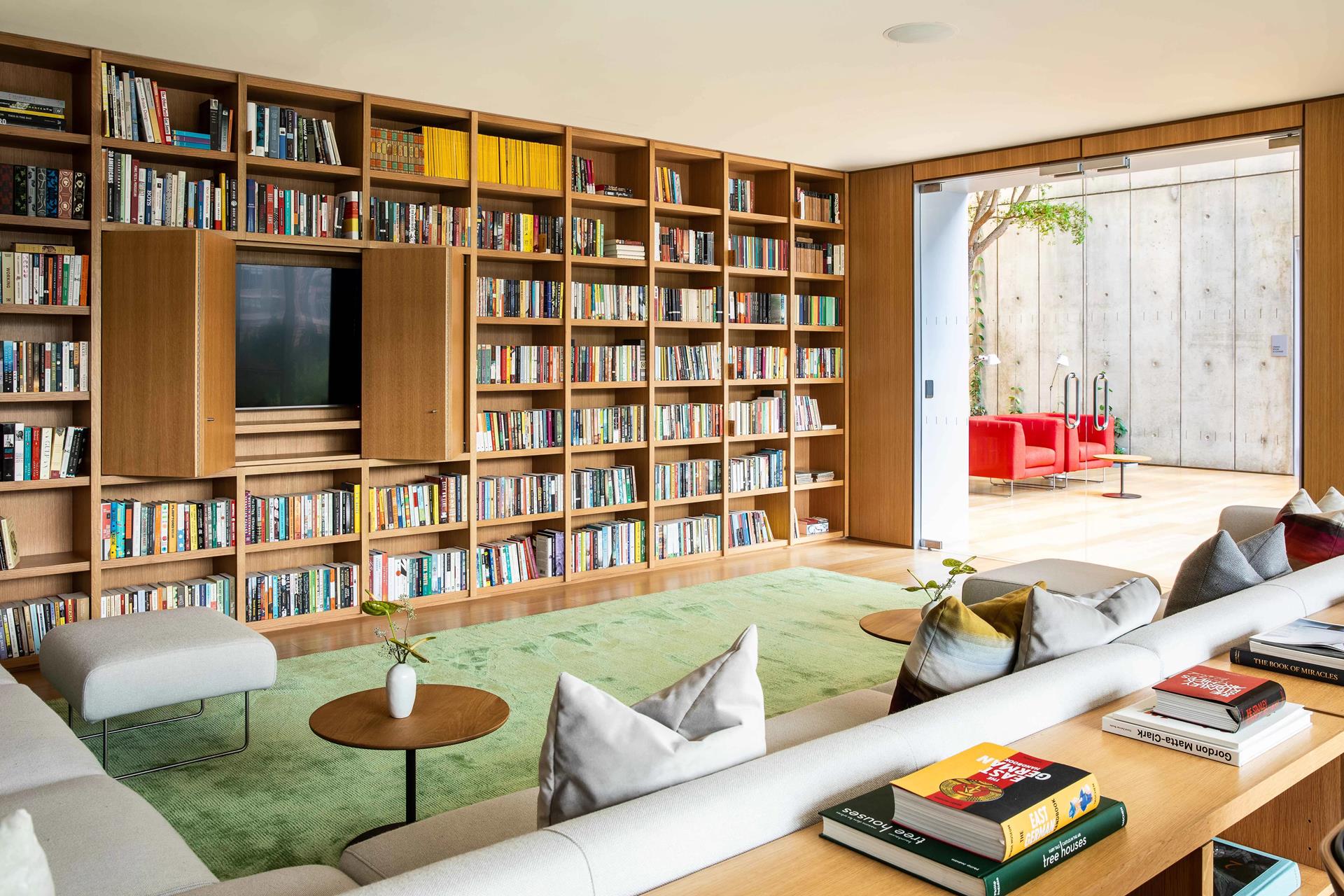565 Broome Street, Unit S28A Manhattan, NY 10013 - Photo 19 of 36 a living room with furniture and a book shelf