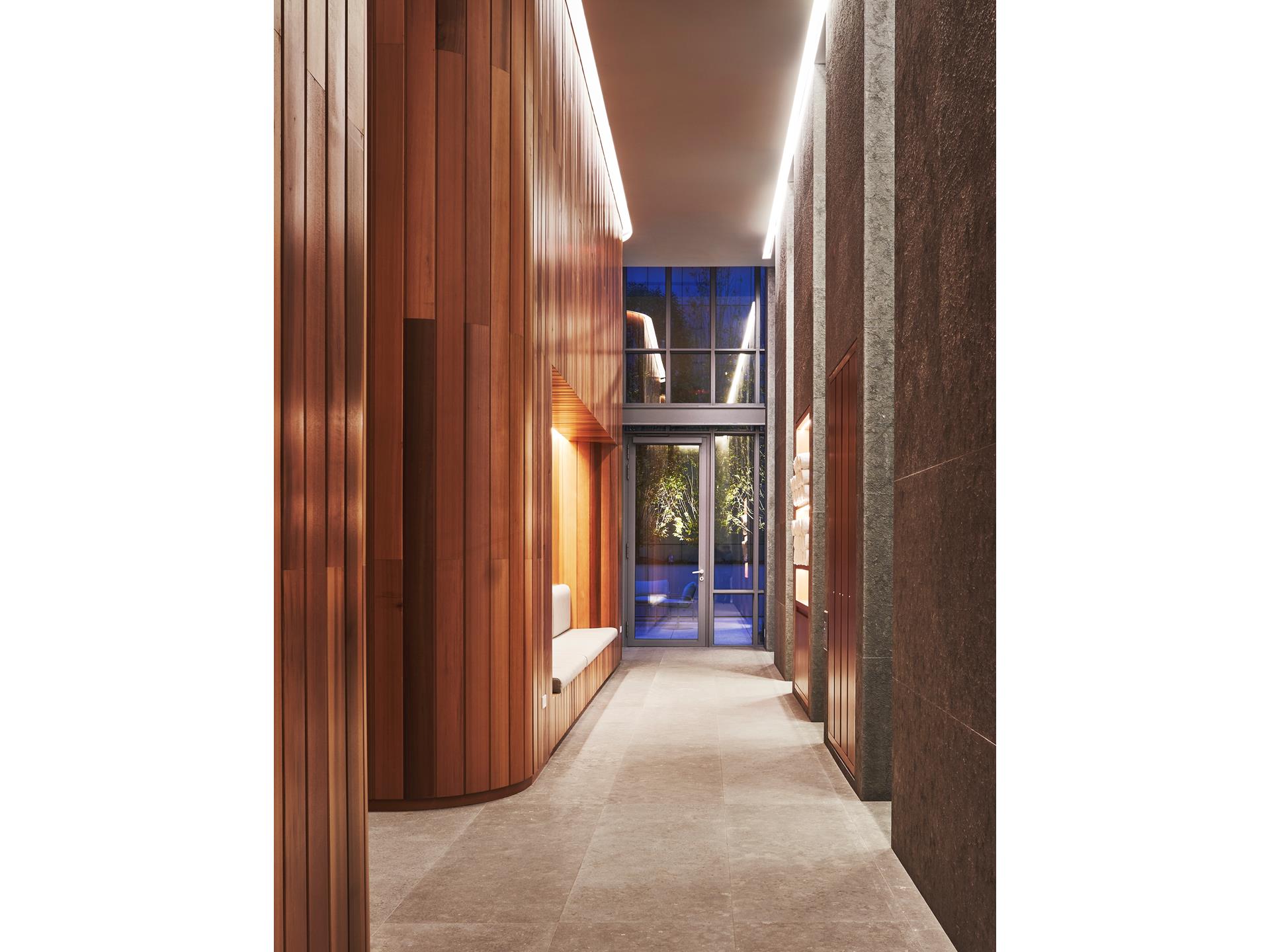 565 Broome Street, Unit S28A Manhattan, NY 10013 - Photo 22 of 36 a view of a hallway with wooden shelves