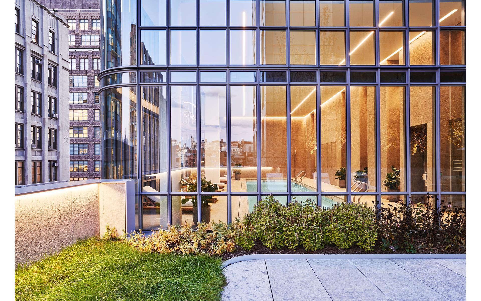 565 Broome Street, Unit S28A Manhattan, NY 10013 - Photo 28 of 36 a view of a building with a garden